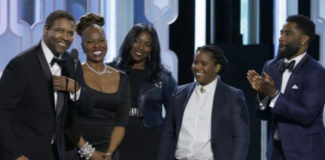 Katia Washington, second from left with her family.